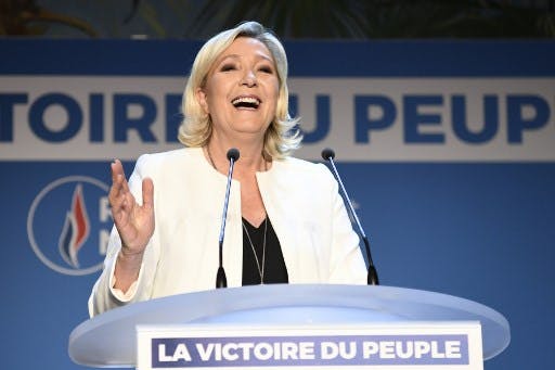 French far-right Rassemblement National (RN) President and member of Parliament Marine Le Pen delivers a speech after the announcement of initial results during an RN election-night event for European parliamentary elections on May 26, 2019, at La Palmeraie venue in Paris. (Photo by Bertrand GUAY / AFP)