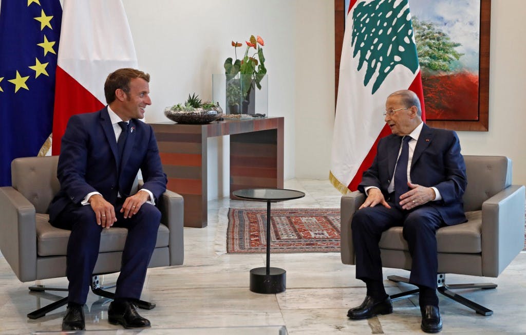 French President Emmanuel Macron (L) meets with Lebanese President Michel Aoun at the Presidential palace in Baabda, east of the Lebanese capital Beirut, on September 1, 2020. (Photo by GONZALO FUENTES / POOL / AFP)