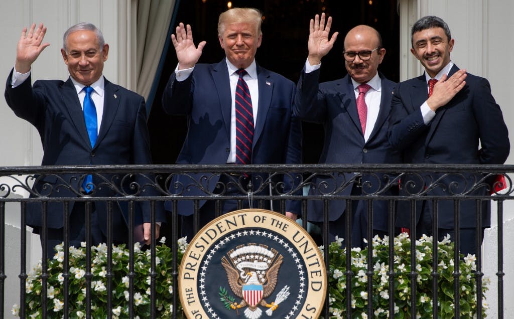 (L-R)Israeli Prime Minister Benjamin Netanyahu, US President Donald Trump, Bahrain Foreign Minister Abdullatif al-Zayani, and UAE Foreign Minister Abdullah bin Zayed Al-Nahyan wave from the Truman Balcony at the White House after they participated in the signing of the Abraham Accords where the countries of Bahrain and the United Arab Emirates recognize Israel, in Washington, DC, September 15, 2020. - Israeli Prime Minister Benjamin Netanyahu and the foreign ministers of Bahrain and the United Arab Emirates arrived September 15, 2020 at the White House to sign historic accords normalizing ties between the Jewish and Arab states. (Photo by SAUL LOEB / AFP)