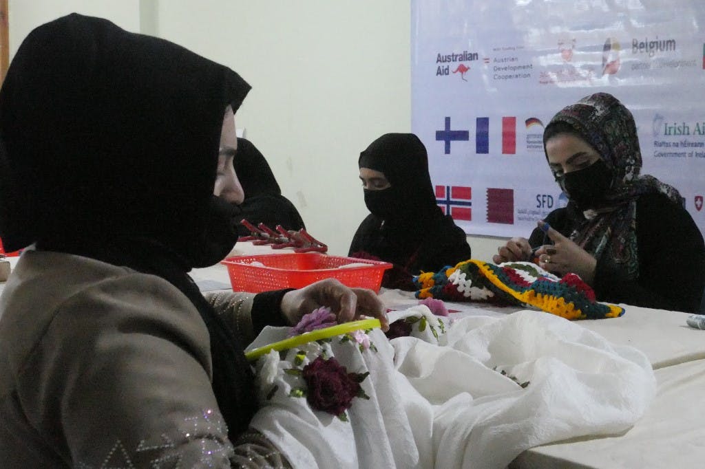 زنان افغانستان در یک سازمان غیردولتی December 22, 2022. (Photo by Mohsen Karimi / AFP)